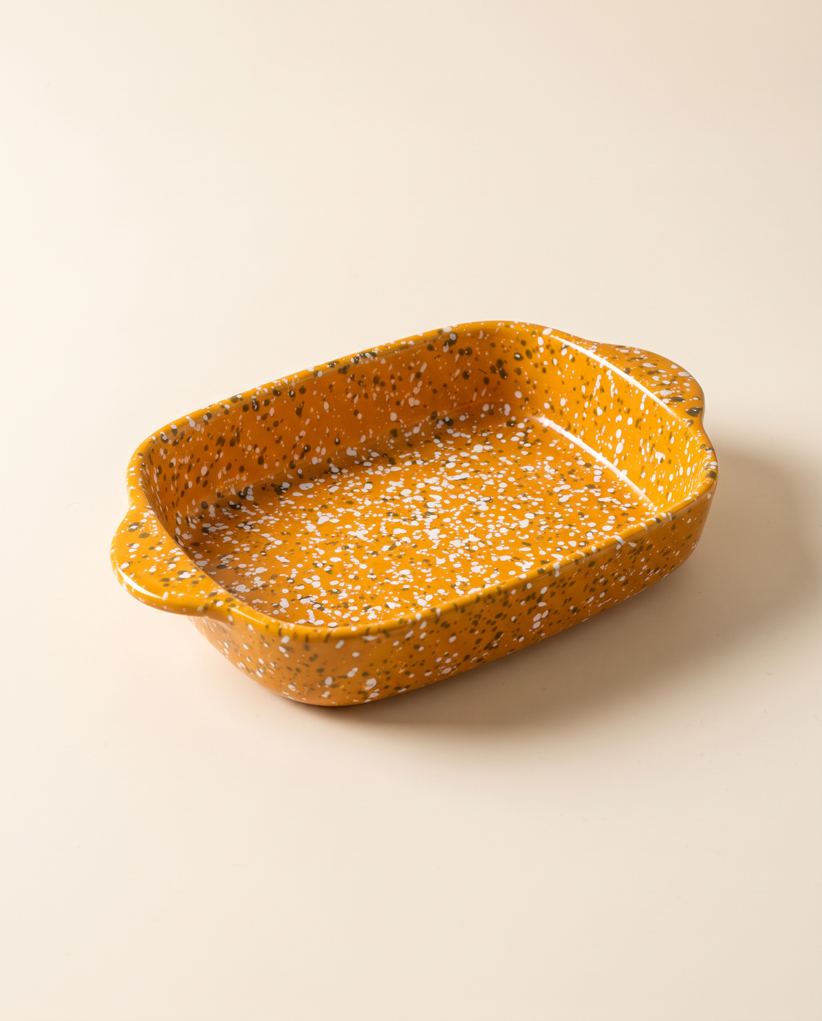 Splatterware ceramic baking dish in Pumpkin glaze